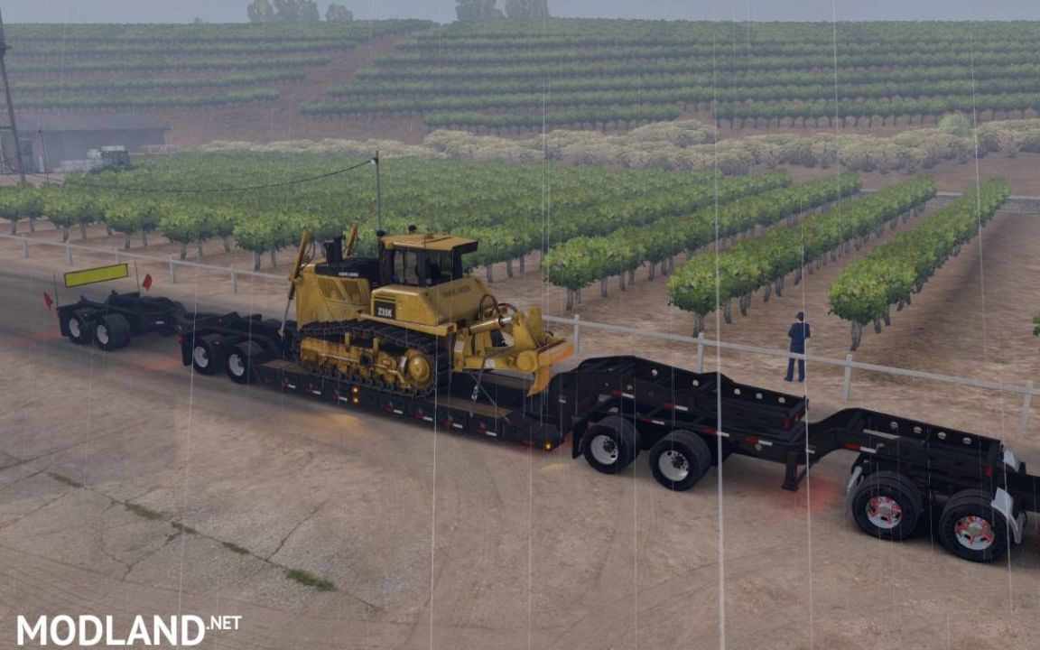 Long Oversized Trailer Magnitude 55l with a Load Bulldozer
