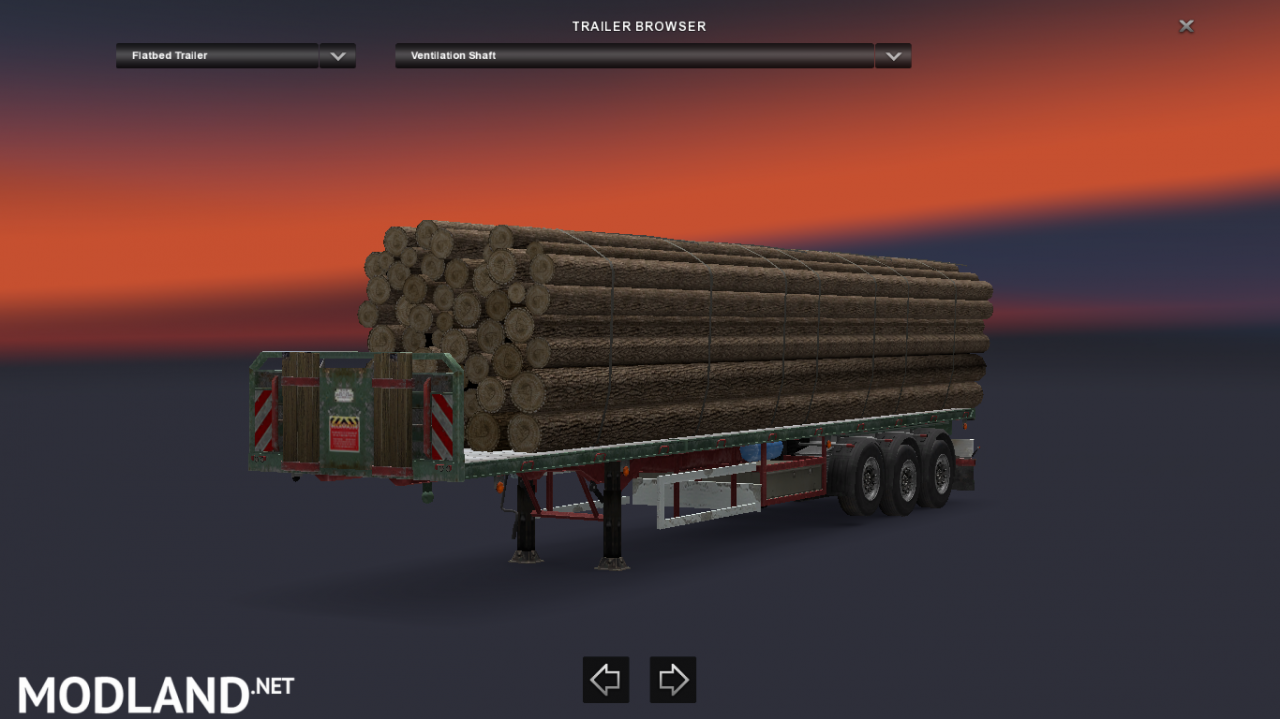 log (wood) trailer on flat bed